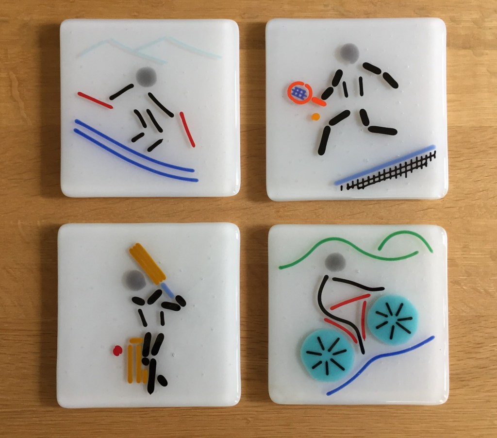 Sports coaster set - skiing, tennis, cricket and cycling.