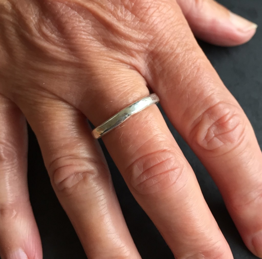 Silver ring with hammered finish