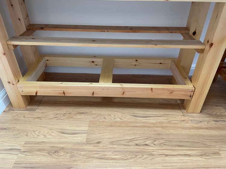 Framework used for shelves on workbench.