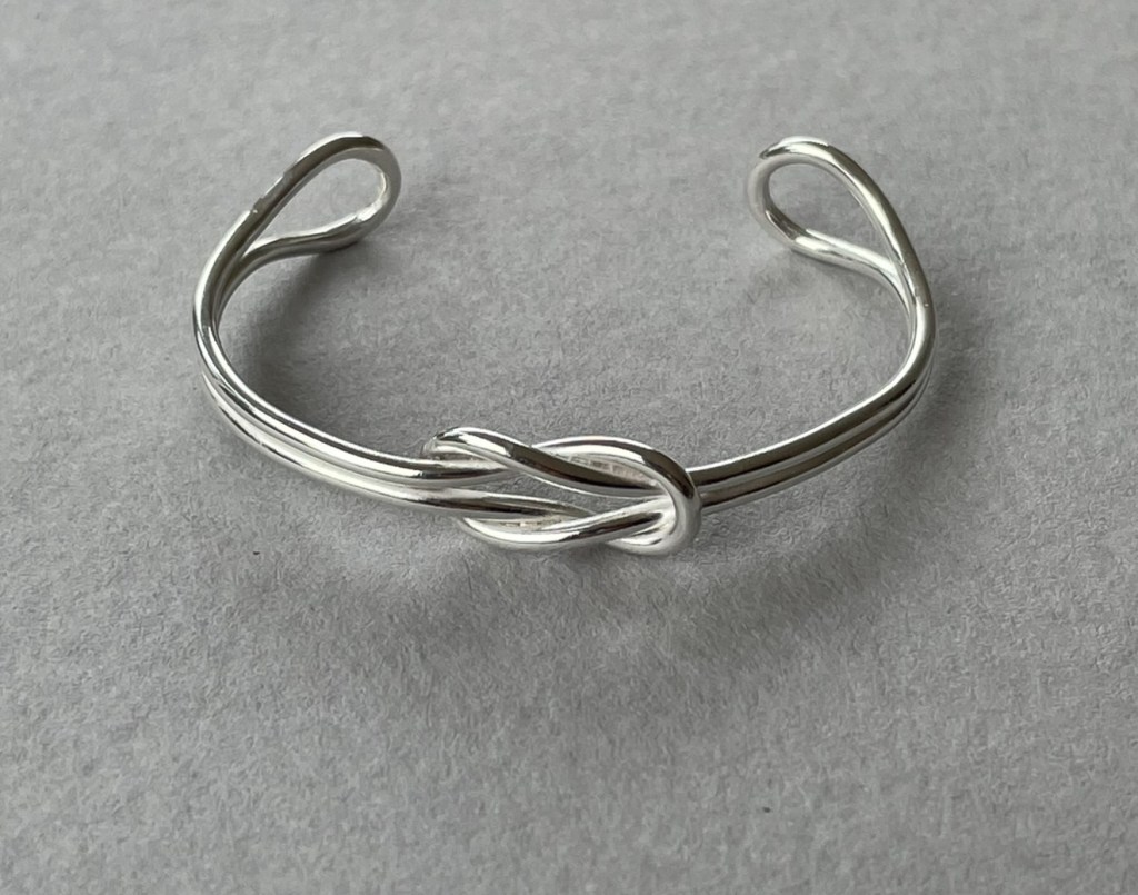 A reef knot bangle in sterling silver