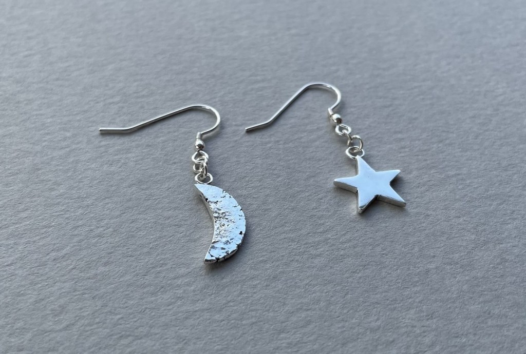 Moon and star earrings made by reusing silver. Reticulation used to texture moon.