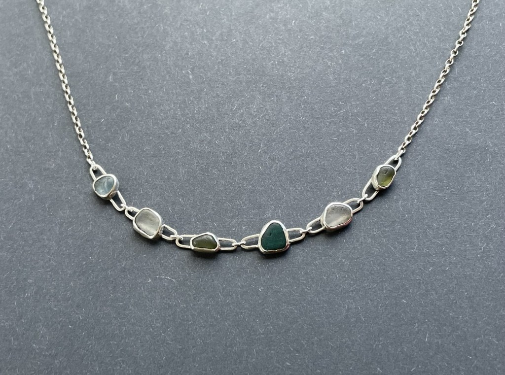 Necklace made from sea glass using silver bezels.