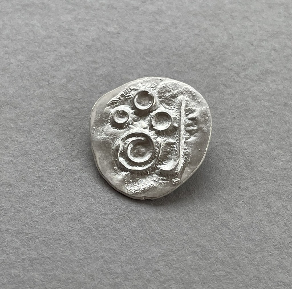 Silver brooch made using depletion gilding and reticulation.